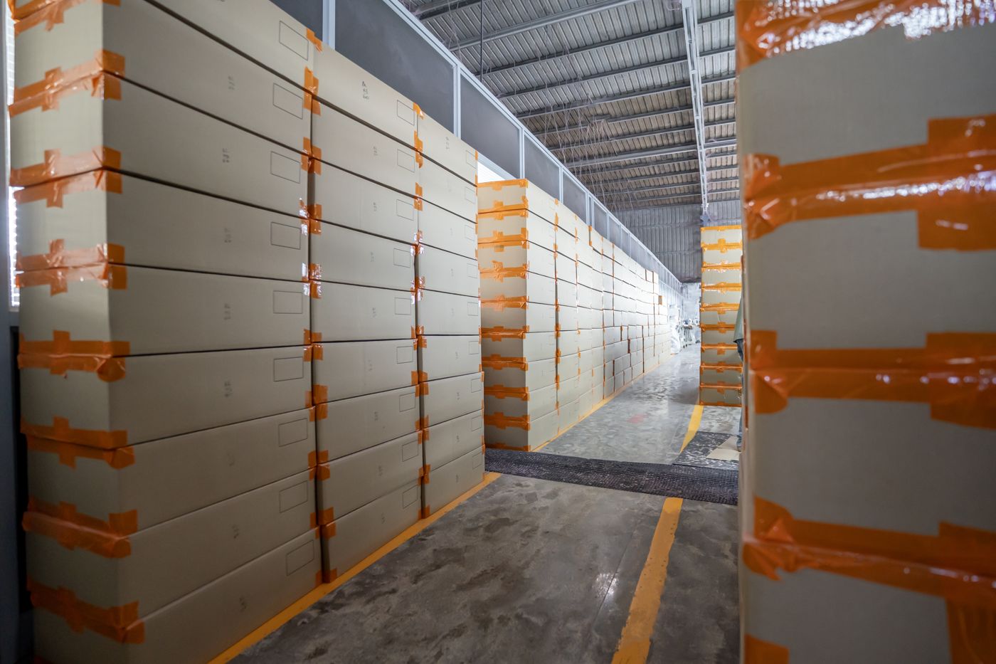 Warehouse racks stacked with cartons